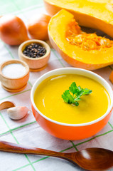 Pumpkin soup served on the table in bowl