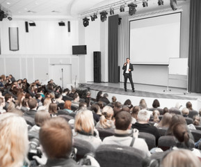 speaker conducts the business conference for journalists and novice entrepreneurs