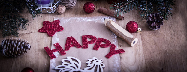 greeting card,pencil,candle and Christmas decoration on wooden b