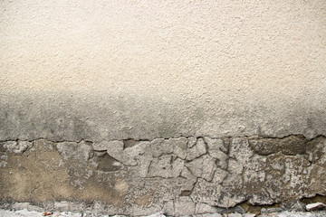 old textured wall of a house of concrete