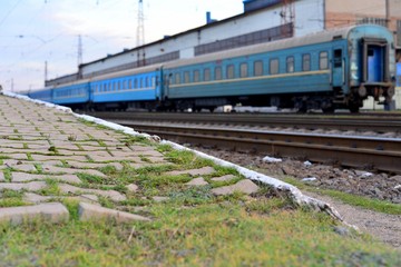 Fototapeta premium Passenger and freight train. Passenger diesel train traveling speed railway wagons journey light