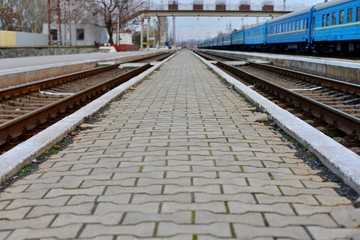 Naklejka premium Passenger and freight train. Passenger diesel train traveling speed railway wagons journey light