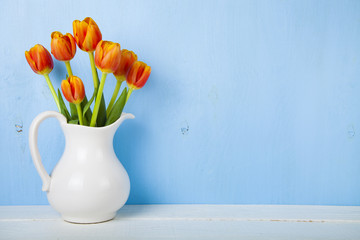 Tulips in a white jug