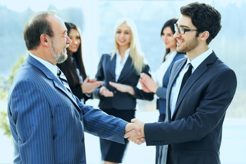 Fototapeta premium Meeting of two business partners at the presentation, greeting with a handshake
