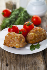 Delicious cutlets, tomatoes and parsley