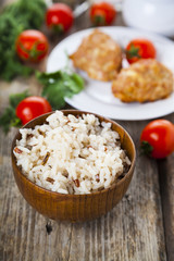 Delicious cutlets, rice, tomatoes and parsley