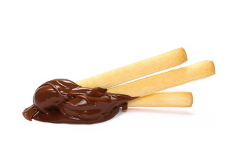 Bread sticks dipped, covered in creamy chocolate, isolated on white background