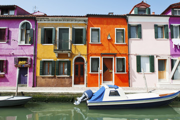 Fototapeta na wymiar Venice, Burano island, Italy - scenic view of characteristic colorful buildings and the canal