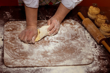 Female hands making dough for pizza. Making bread. Cooking Process Concept 