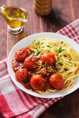 Plate of pasta with cherry tomato sauce and olive oil