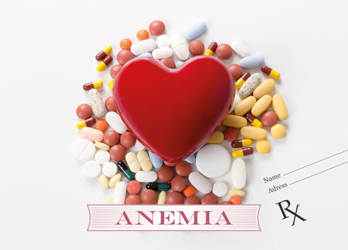 ANEMIA written on heart and medication background