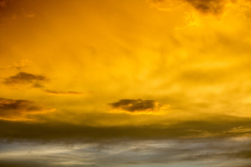 Obraz premium The sky after a summer thunderstorm. Orange cumulus clouds. Sunset. .Thunder Sky
