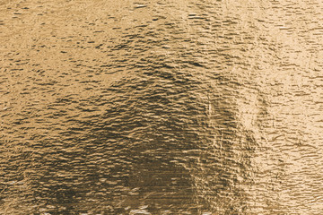 Gold shiny foil background, yellow gloss metallic texture