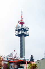 Large communication tower, closeup, in cloudy weather