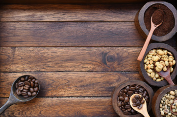 Close up of coffee beans and ground coffee in wooden bowl