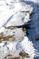 road on snow-covered field