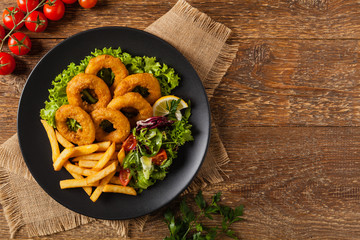 Roasted squid rings with fries