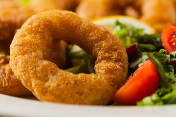 Roasted squid rings with salad.