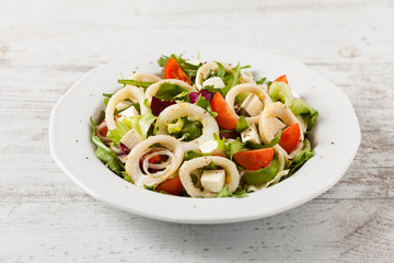 Salad with squid rings.