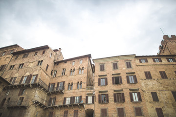 Tuscany architectural buildings on street in Siena