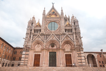 Fototapeta na wymiar French Gothic architecture facade of Siena Cathedral