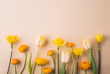 Easter and spring flat lay on a cream background.