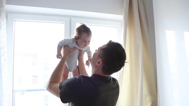 Father nad son have a fun together at home
