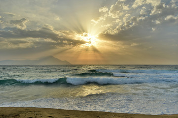 Magical sunrise sky and sea waves