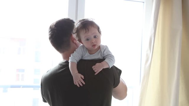 Father nad son have a fun together at home