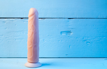 Realistic vibrator on a blue background,