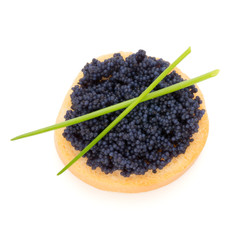 Canapes with black sturgeon caviar and  spice isolated on the white background.