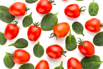 Spinach and tomato pattern background on white. Top view