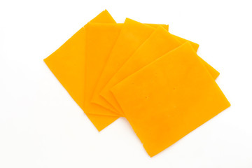 Cheddar cheese slice isolated on the white background.