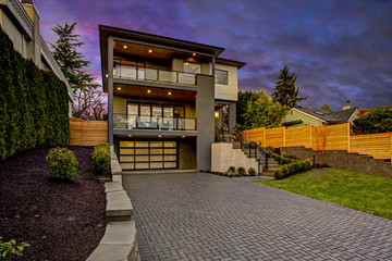 Luxury modern home exterior at sunset