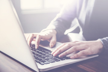 Woman working on computer inside