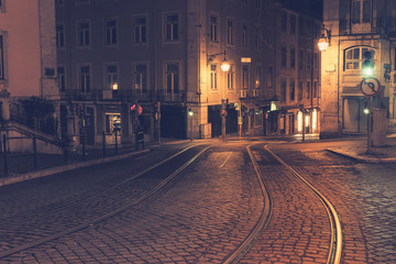 Fototapeta na wymiar Illuminated street of old european town at night