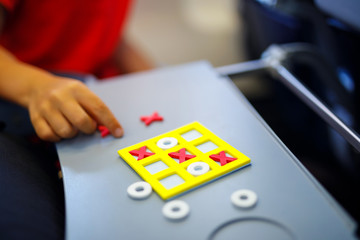 Tic tac toe game. Leisure activity for kids and adults. At home, traveling, on plane.