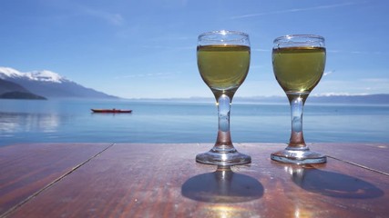 Two glasses of rakija against Ohrid Lake, Macedonia
