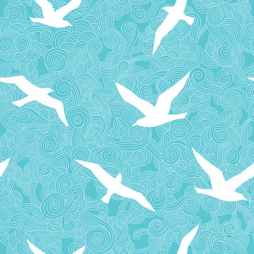 seagull/Seamless pattern with seagulls against the blue sky.