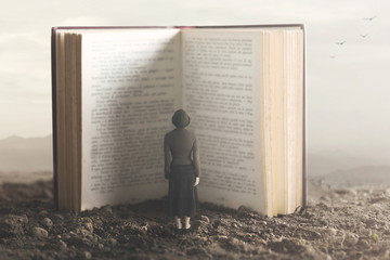surreal moment of a small woman reading a giant book - obrazy, fototapety, plakaty