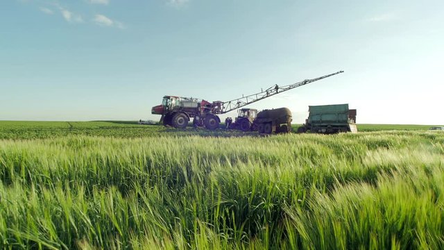 Tilt up irrigation tractors on a wheat field