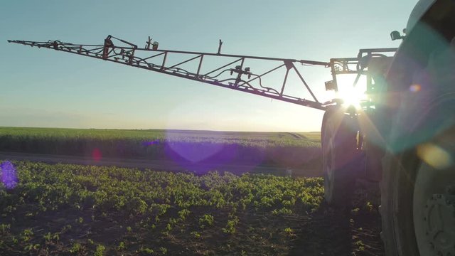 Contre jour of an irrigation tractor