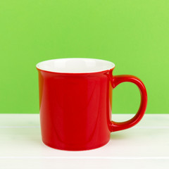 red cup with green background