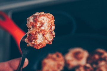 Cooking chops, cutlet on the fork right in the mouth, gourmet dish