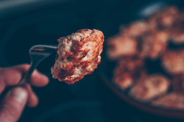 We try a fresh hot cutlet with a fork