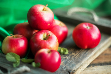 group of red apples on wooden natural background, fresh natural food and vitamins concept in rustic style