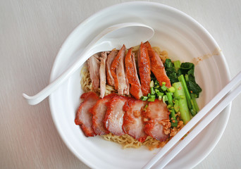 Egg noodle with roasted duck and pork.
