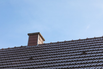 chimney roof house with blue sky