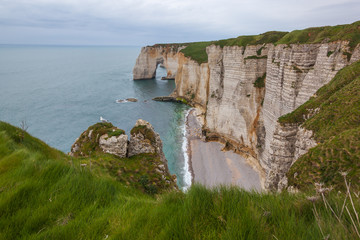 Fototapeta na wymiar Famous chalk cliffs and natural arches located on the coast of the Pays de Caux area at Etretat, Normandy, France