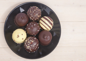 Typical Dutch chocolate treat with wipped cream inside on wooden background